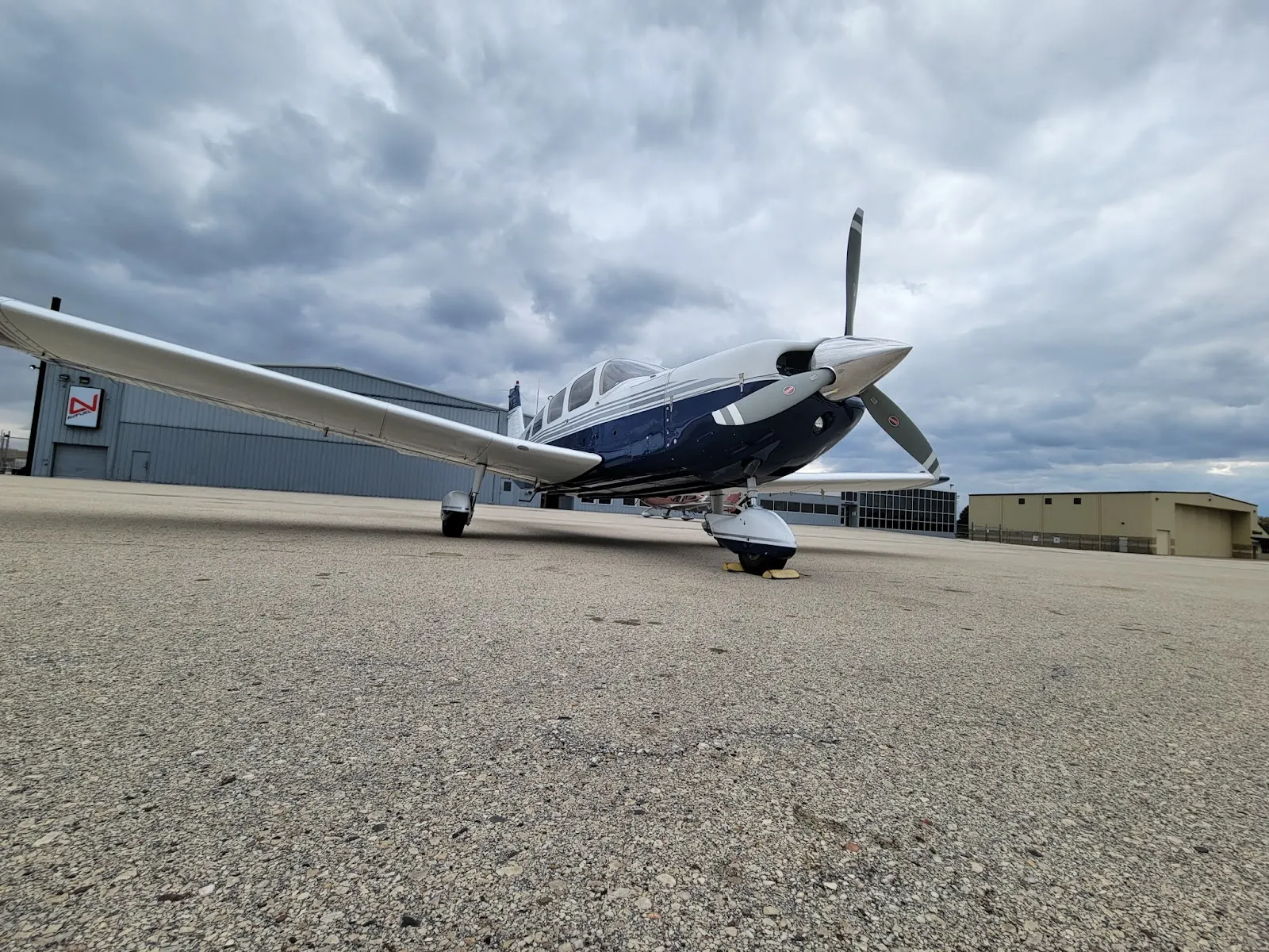 Low-angle view of the Cherokee Six under a cloudy sky