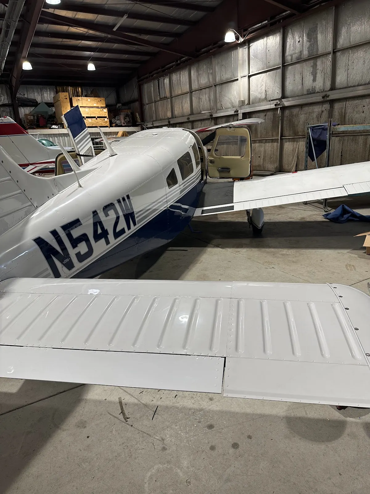Wing and fuselage inside the hangar