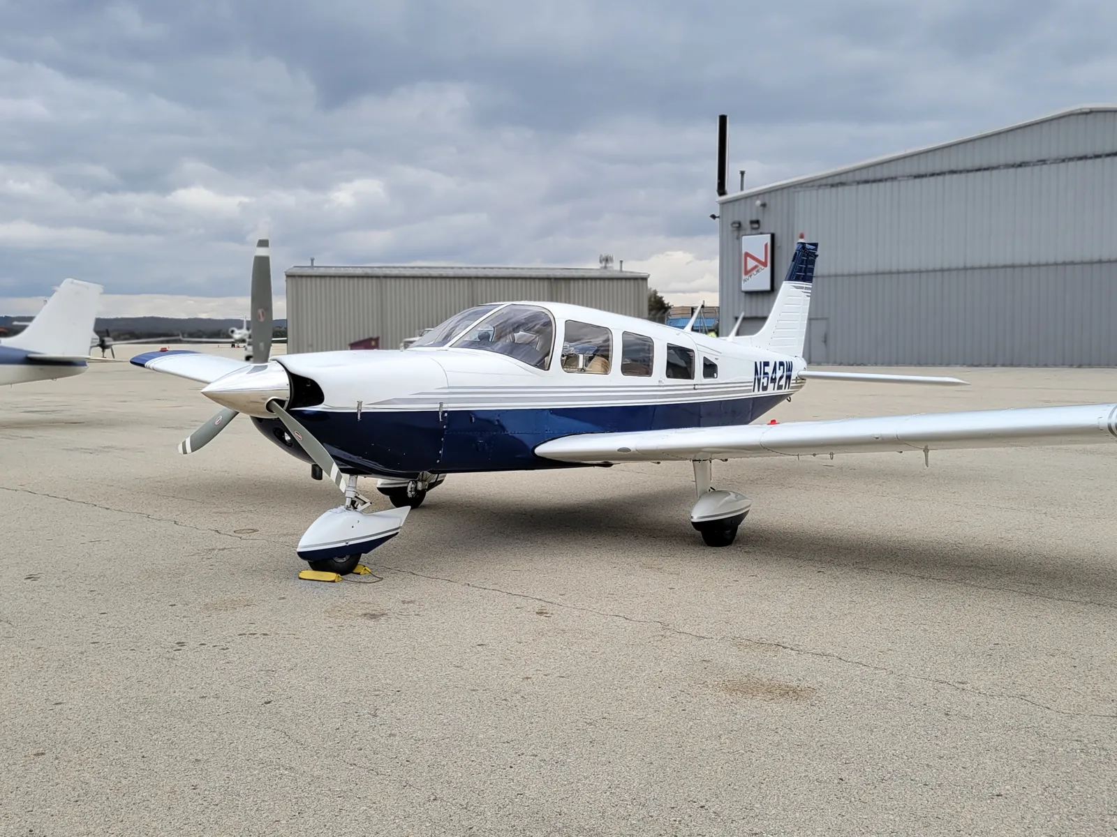 N542W on the ramp in front of the hangars