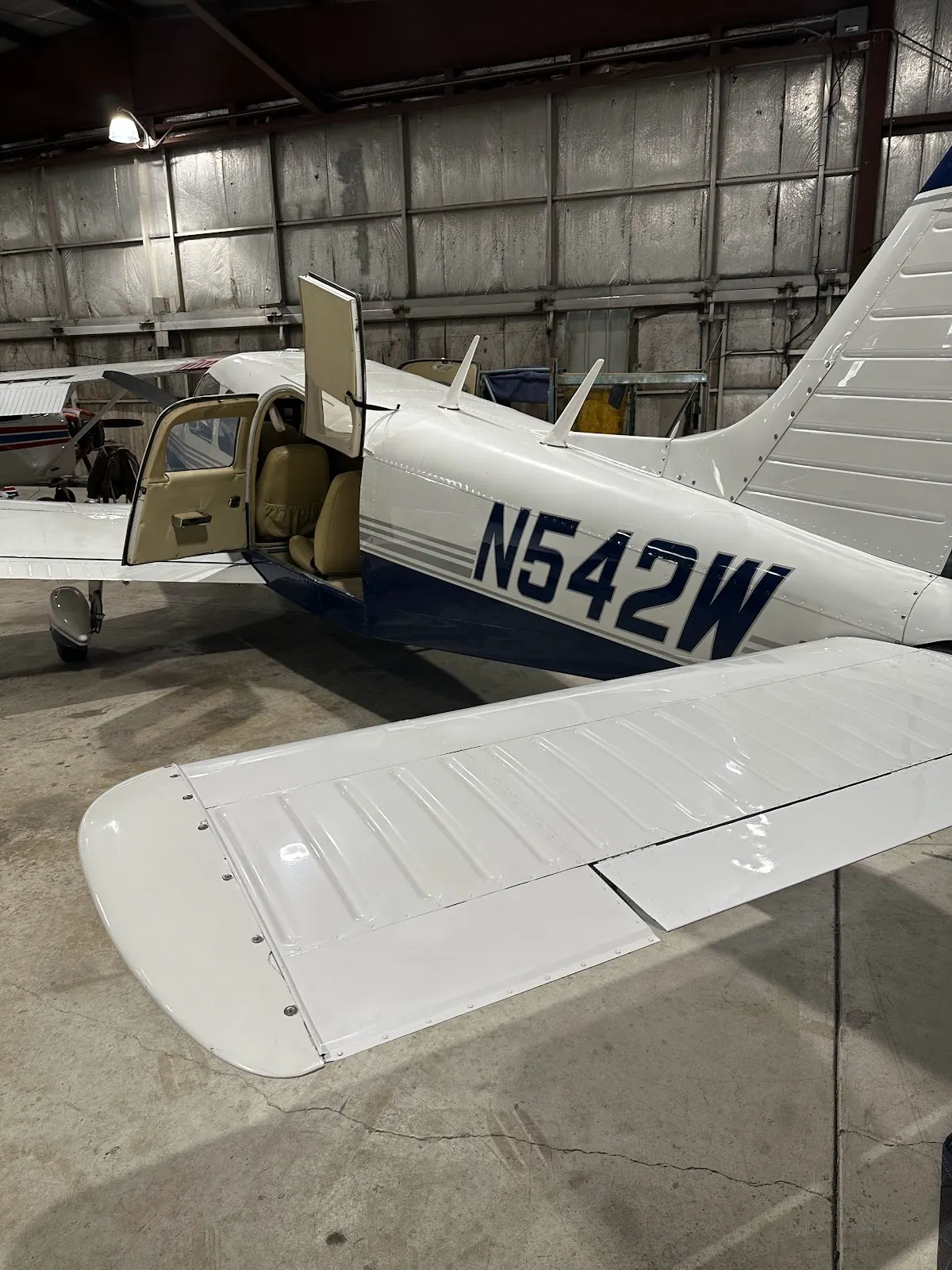 N542W tucked inside the hangar