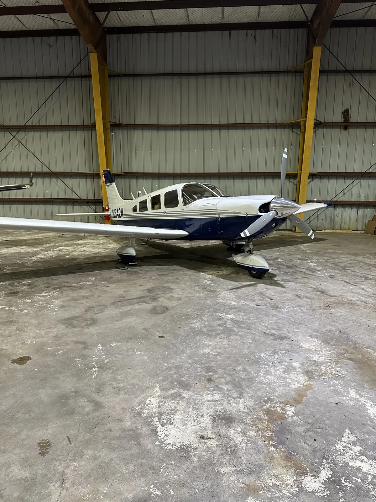 N542W parked inside the hangar