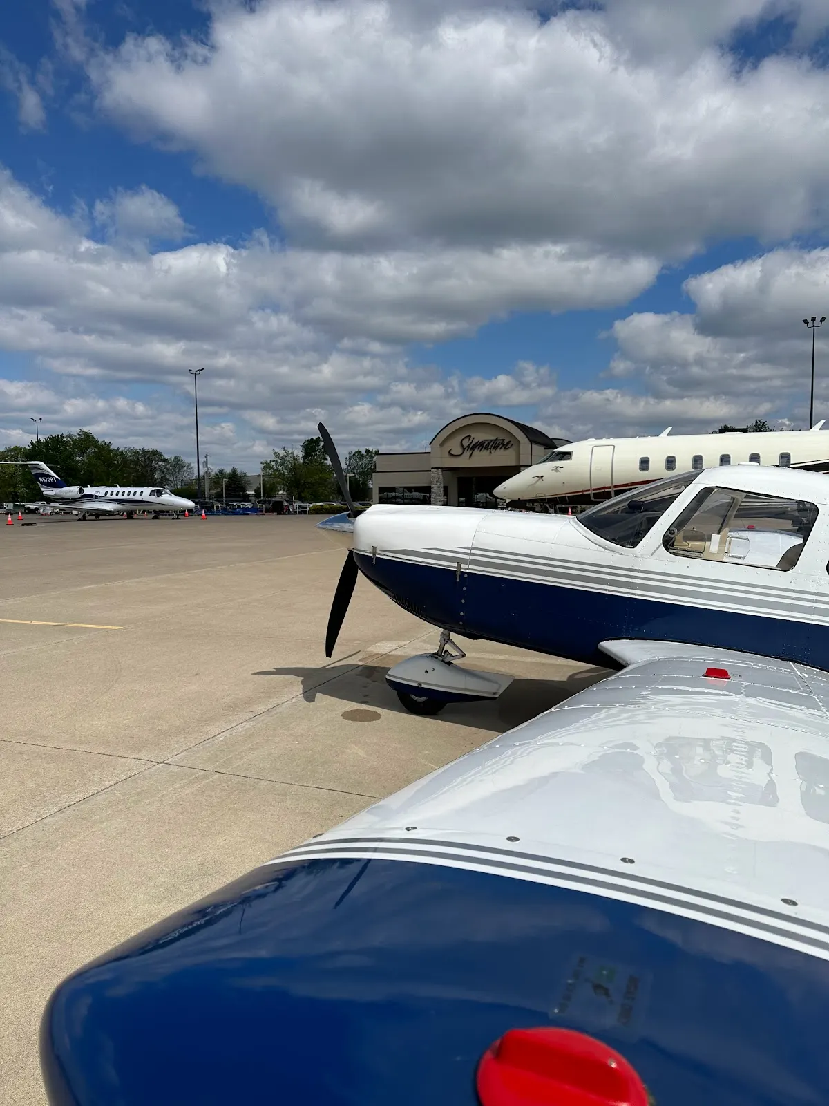 Nose and wing on the ramp under blue sky